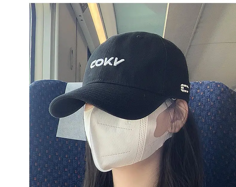 Beige Embroidered Baseball Cap with Face Design — feature 18