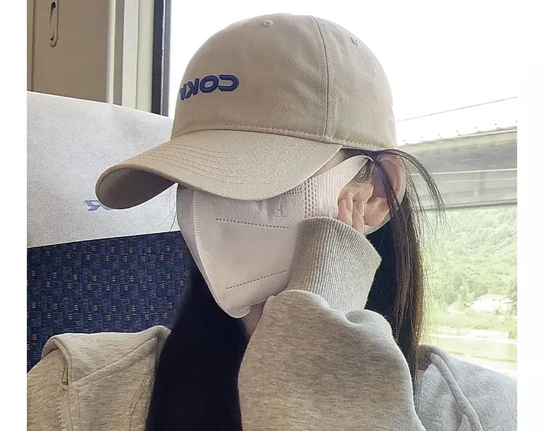 Beige Embroidered Baseball Cap with Face Design — feature 4