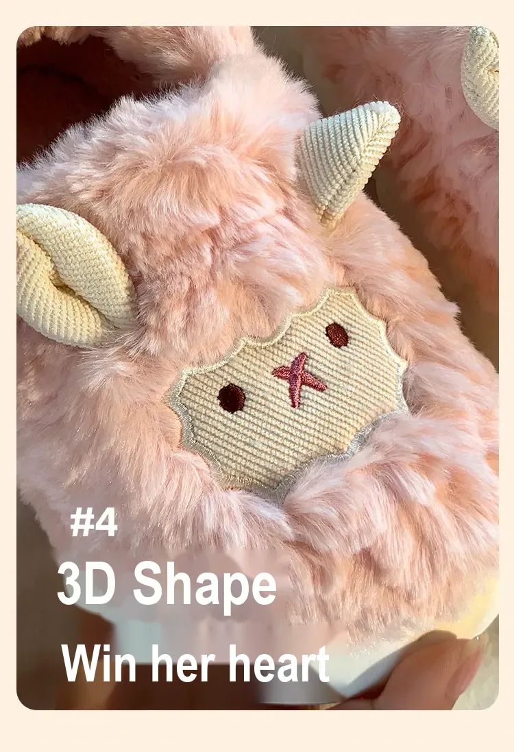 Close-up of embroidered sheep face and raised ears on a pink slipper