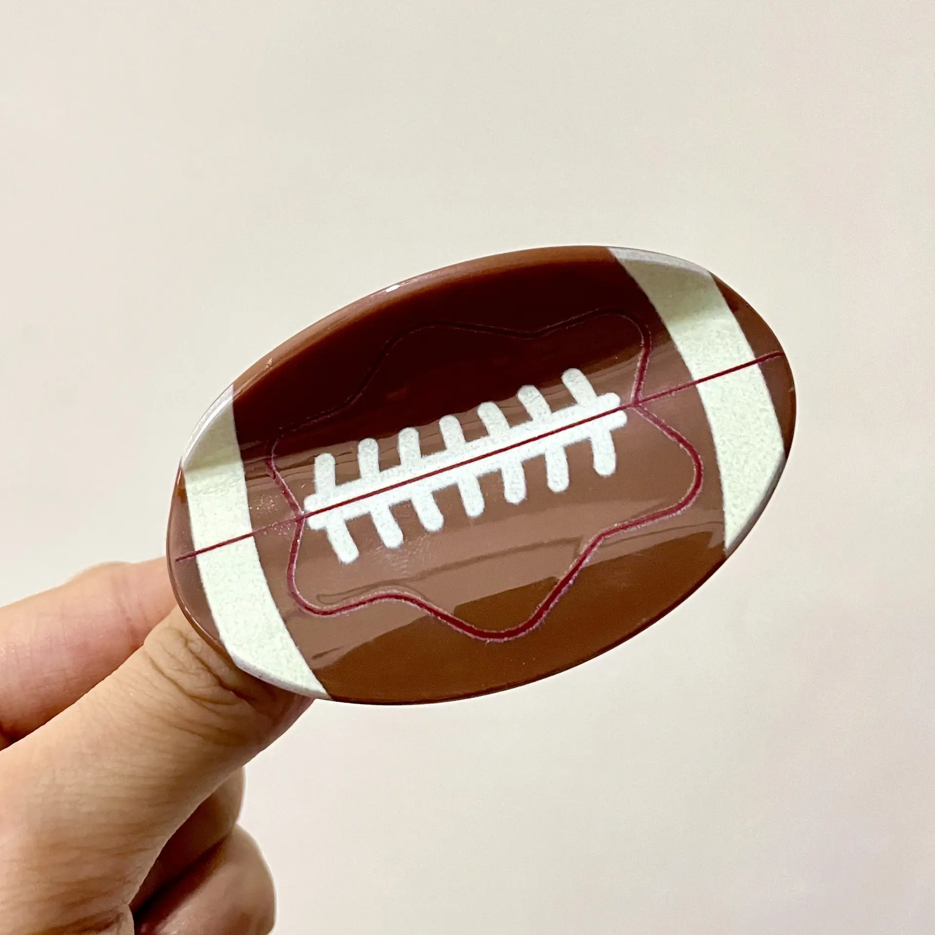 Small rugby (about 6.8cm)