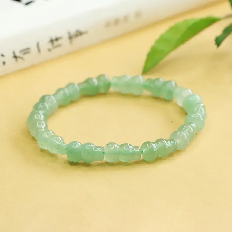 Green Jade Gourd Bracelet with "K" Engraving — feature 1