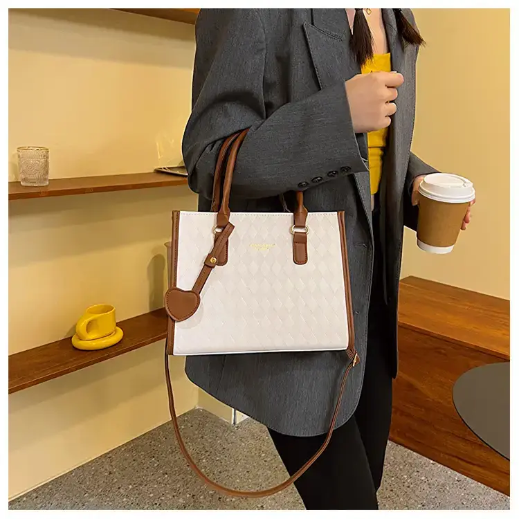Women's Small Quilted Shoulder Bag with Brown Handles — feature 9