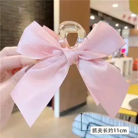 Transparent cross pink bow shark clip
