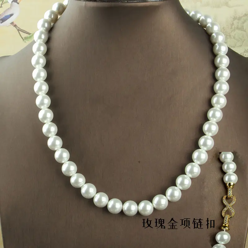 Pearl Beaded Clasp Necklace with Gold Flower Centerpiece — feature 4