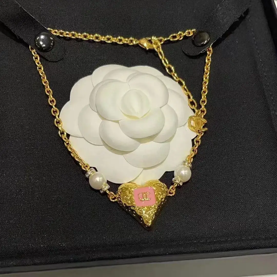 Chanel Heart Pearl Earrings Gold 23K — feature 13