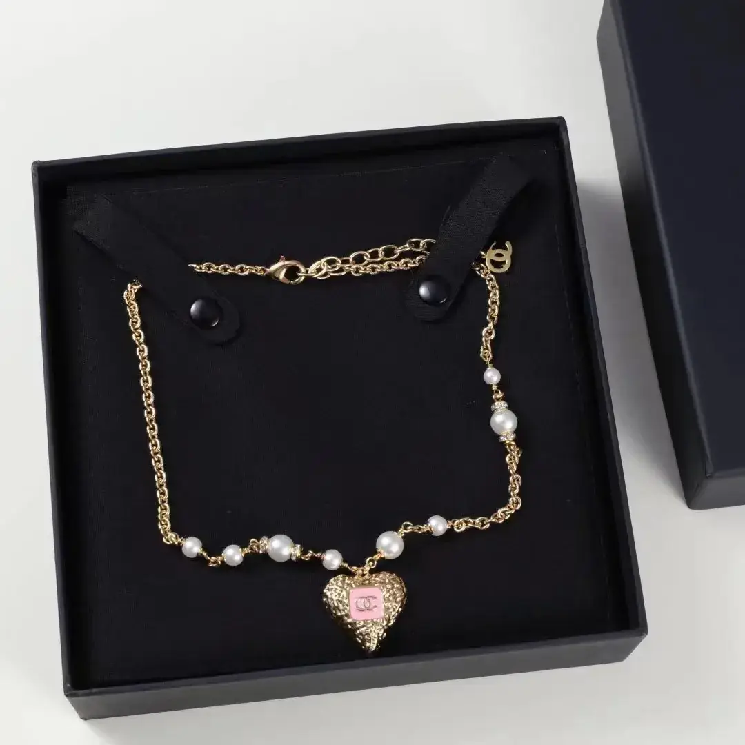 Chanel Heart Pearl Earrings Gold 23K — feature 8