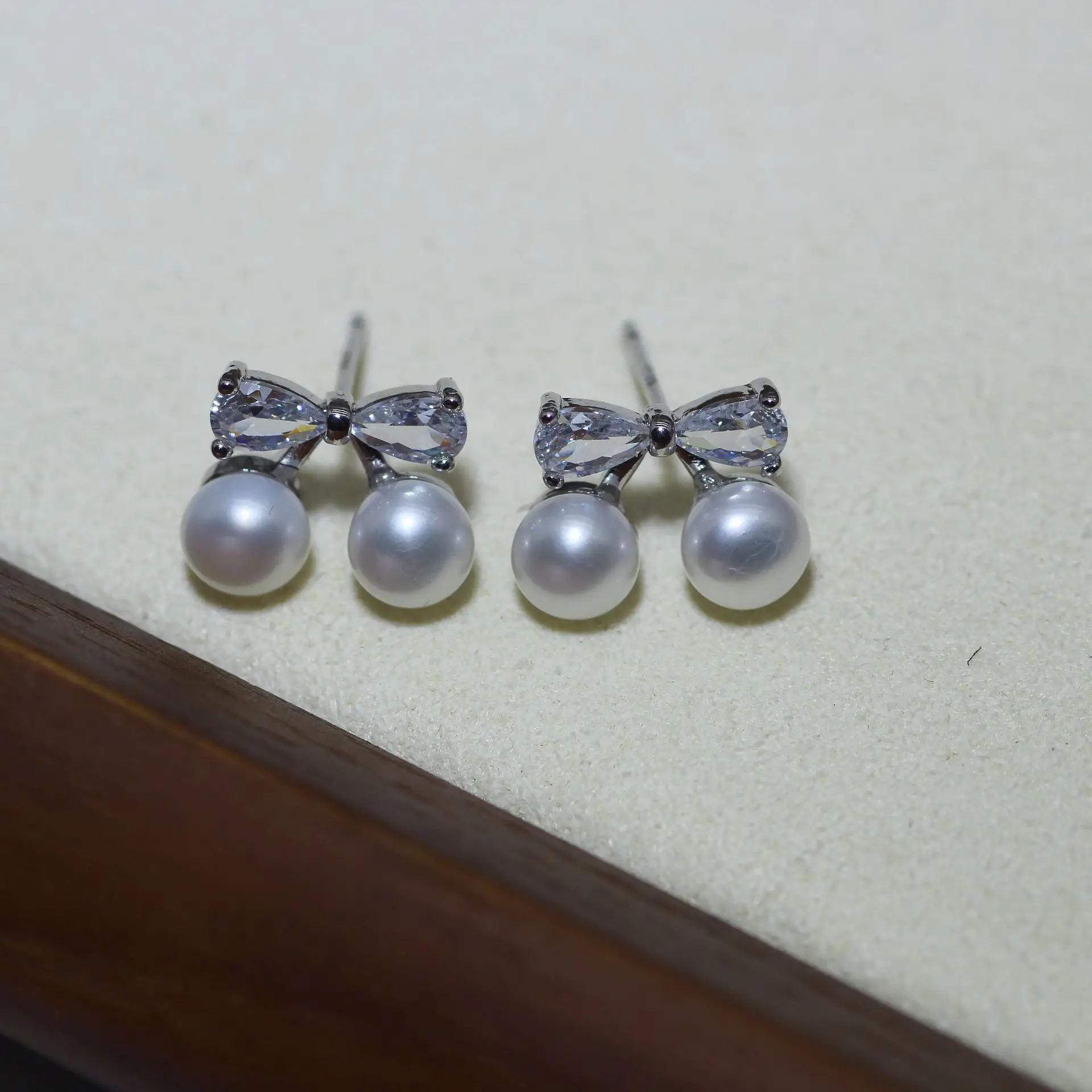 S925 Silver Bow Earrings with Pearl Accents — feature 4