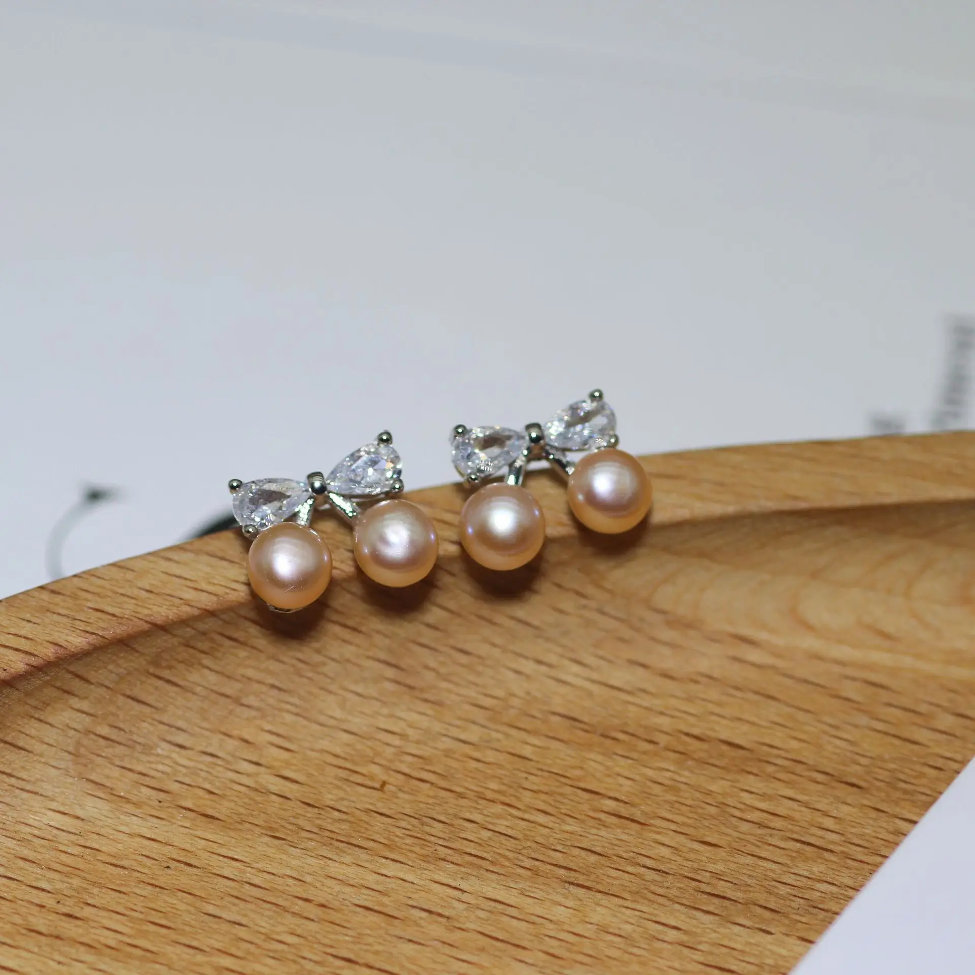 S925 Silver Bow Earrings with Pearl Accents — feature 5