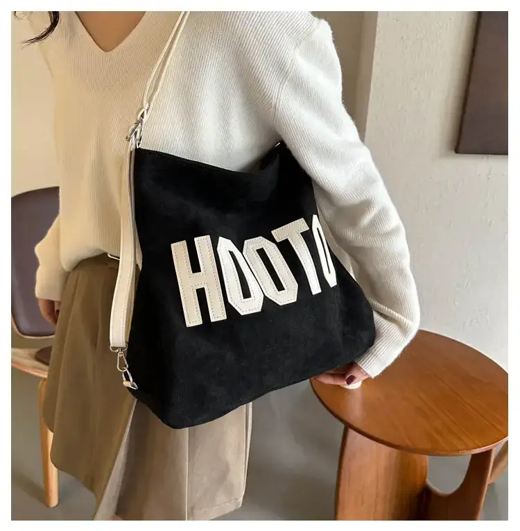 Textured Canvas Shoulder Bag Black White 2023 — feature 12