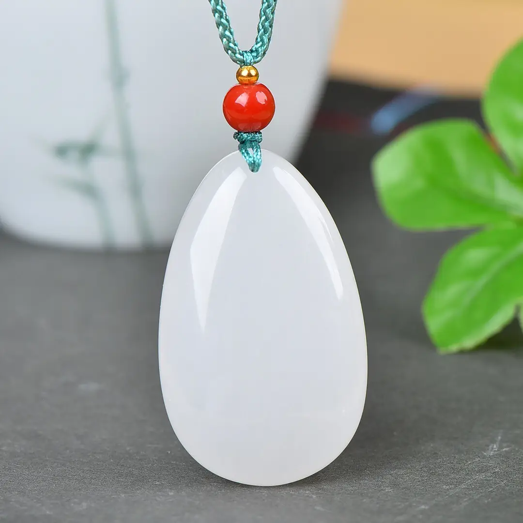 White Jade Water Drop Pendant with Red Bead - Image 4