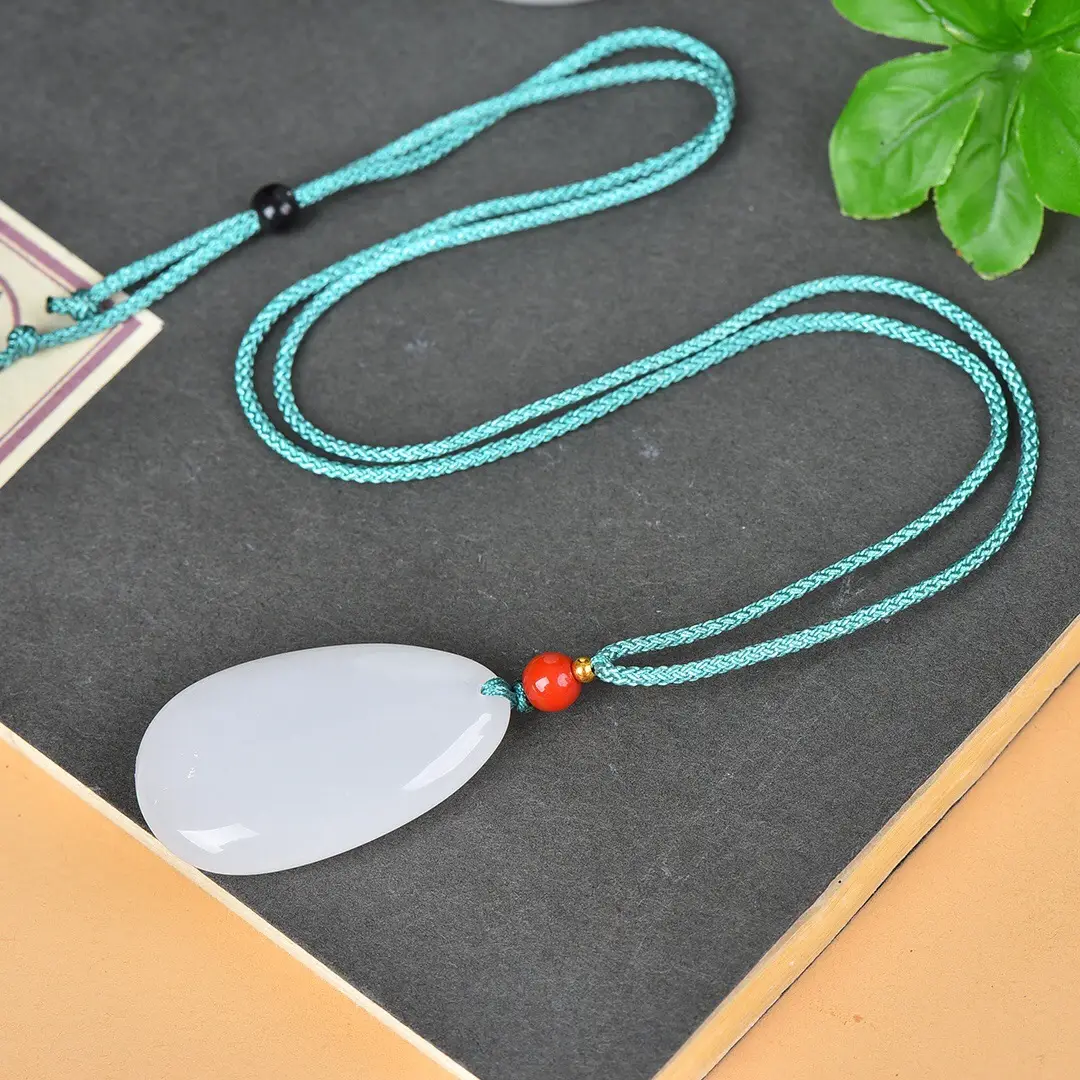 White Jade Water Drop Pendant with Red Bead — feature 7