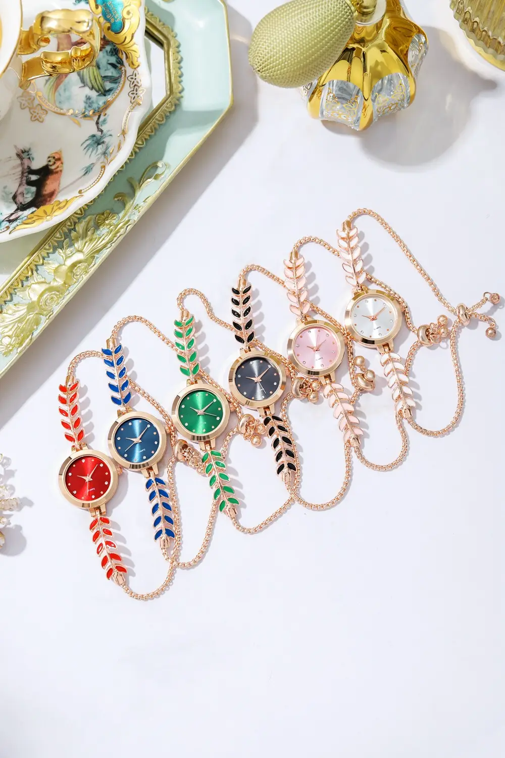 Women's Blue Dial Bracelet Watch with Green Gemstone — feature 1