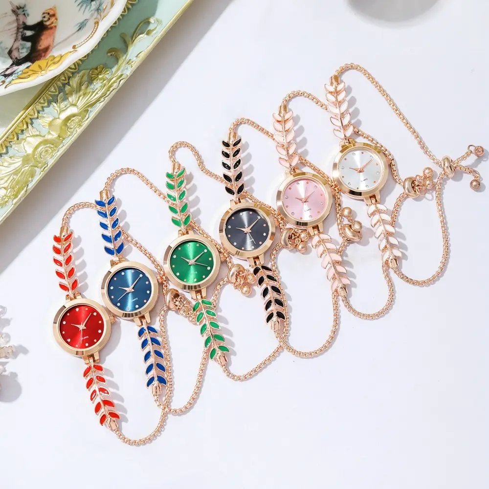 Women's Blue Dial Bracelet Watch with Green Gemstone — feature 11