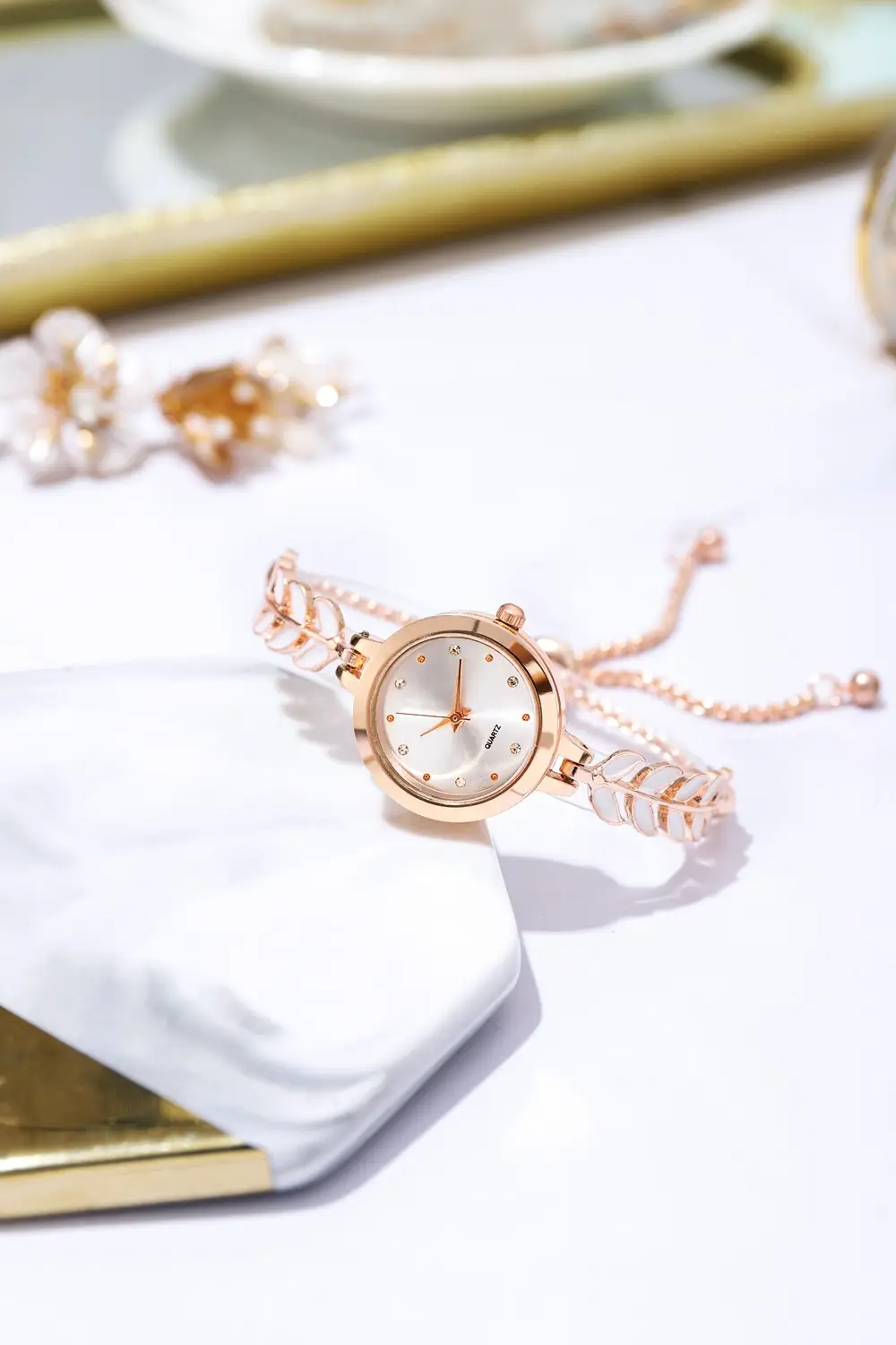 Women's Blue Dial Bracelet Watch with Green Gemstone — feature 3