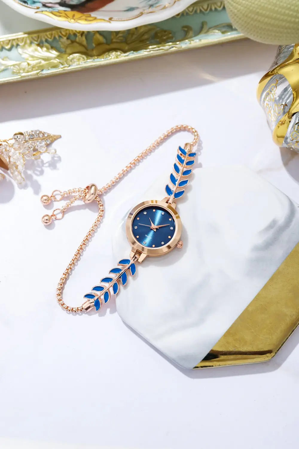 Women's Blue Dial Bracelet Watch with Green Gemstone — feature 4
