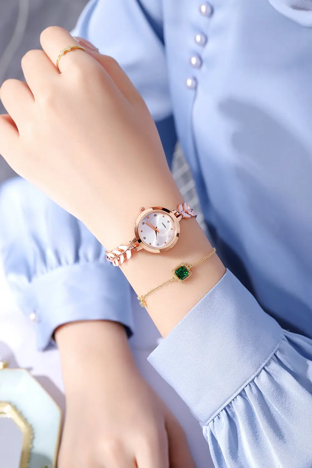 Women's Blue Dial Bracelet Watch with Green Gemstone — feature 5