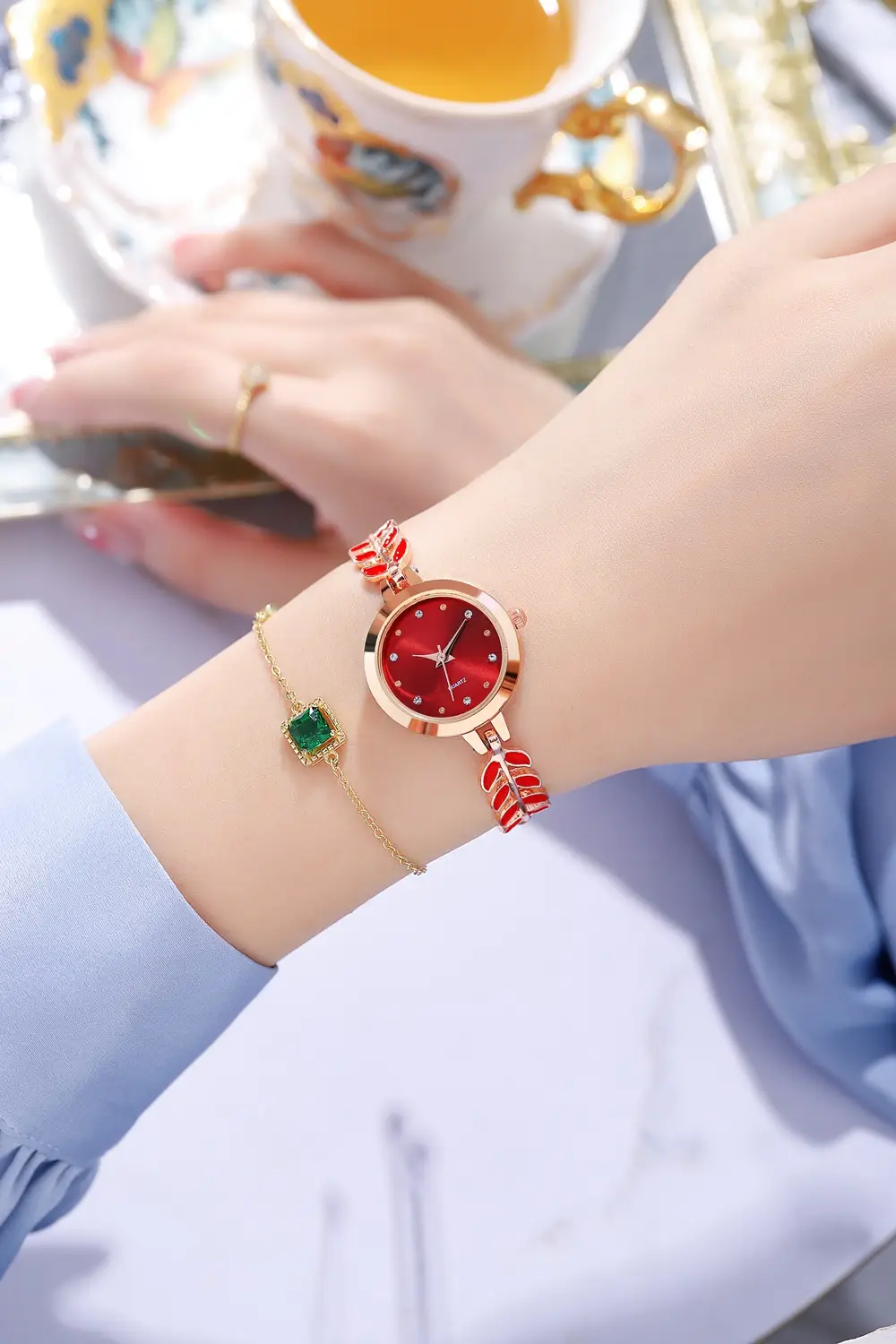 Women's Blue Dial Bracelet Watch with Green Gemstone — feature 6