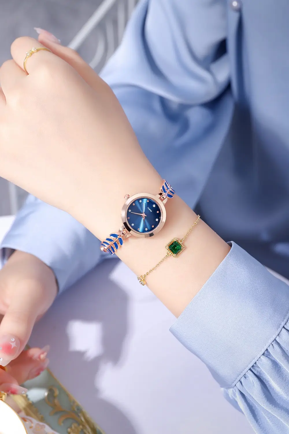 Women's Blue Dial Bracelet Watch with Green Gemstone — feature 7