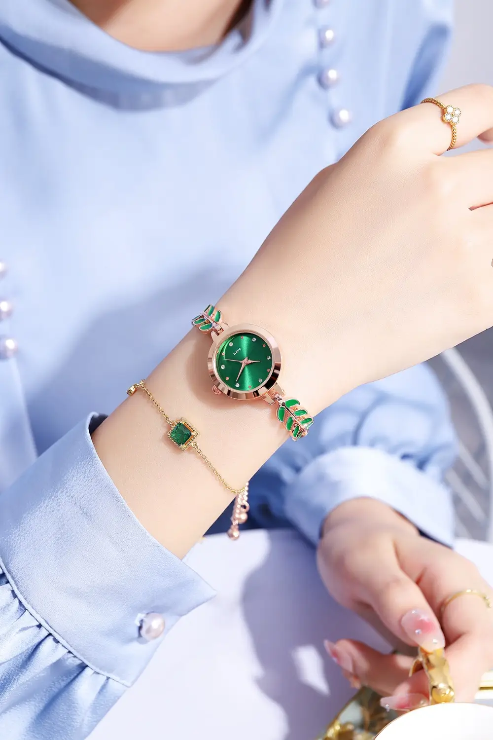 Women's Blue Dial Bracelet Watch with Green Gemstone — feature 8