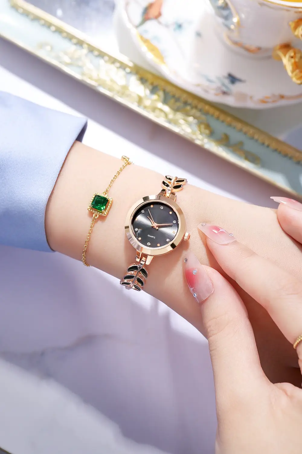 Women's Blue Dial Bracelet Watch with Green Gemstone — feature 9