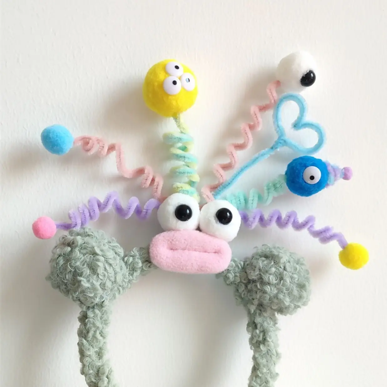 Plush Colorful Headband with Pom Pom Face