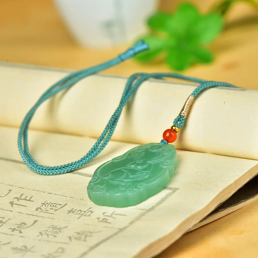 Green Jade Pendant with Red Bead and Embroidered Design - Image 4