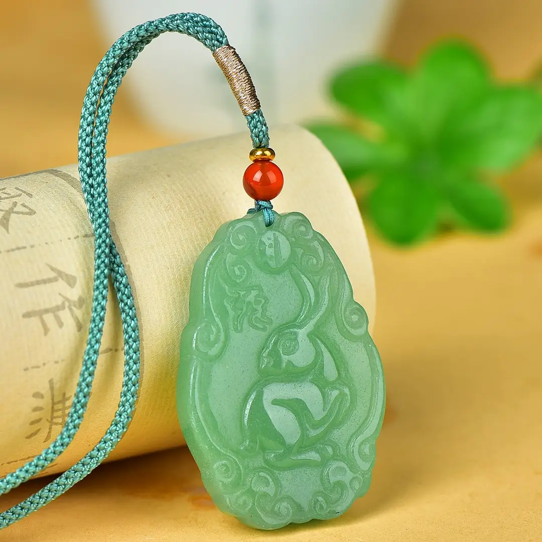 Green Jade Pendant with Red Bead and Embroidered Design — feature 6