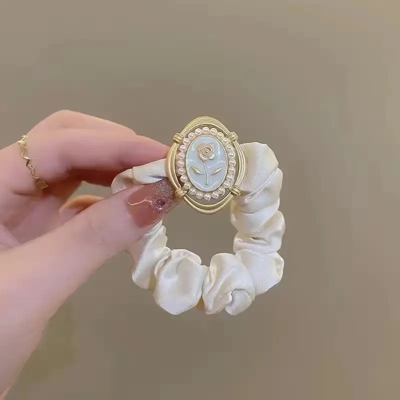 Brown Satin Hair Scrunchie with Gold Logo Watch — feature 6