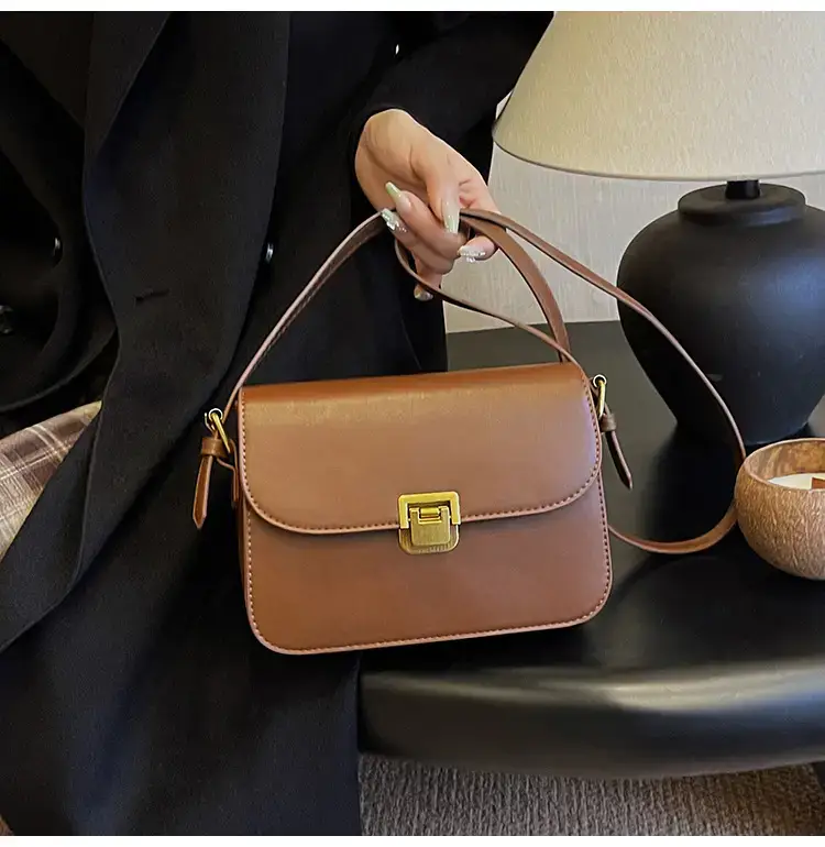 Black Leather Shoulder Bag with Gold Clasp 2023 — feature 18