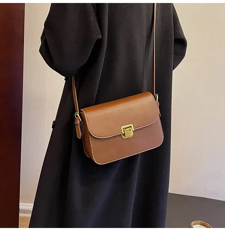 Black Leather Shoulder Bag with Gold Clasp 2023 — feature 19
