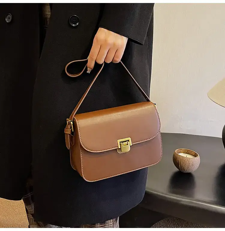 Black Leather Shoulder Bag with Gold Clasp 2023 — feature 20