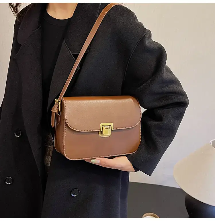 Black Leather Shoulder Bag with Gold Clasp 2023 — feature 21