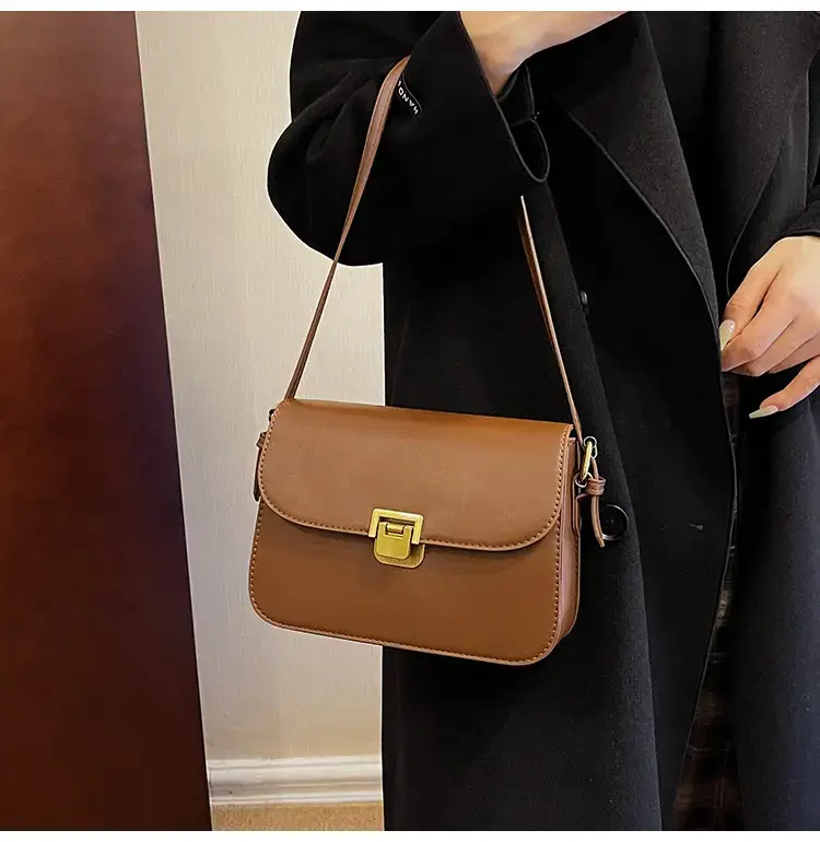 Black Leather Shoulder Bag with Gold Clasp 2023 — feature 22