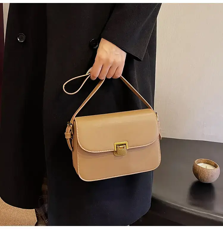 Black Leather Shoulder Bag with Gold Clasp 2023 — feature 24