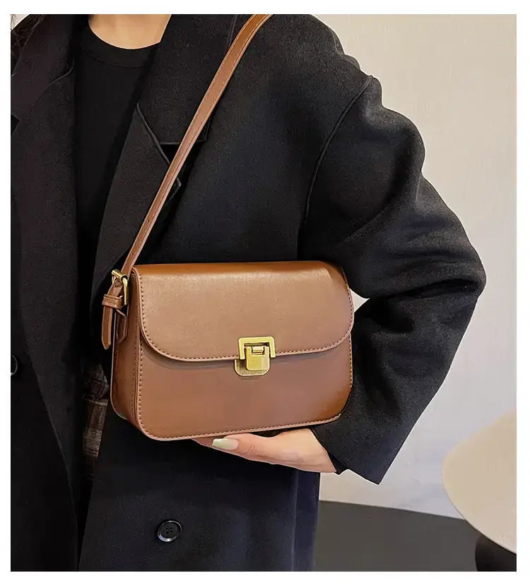 Black Leather Shoulder Bag with Gold Clasp 2023 — feature 3