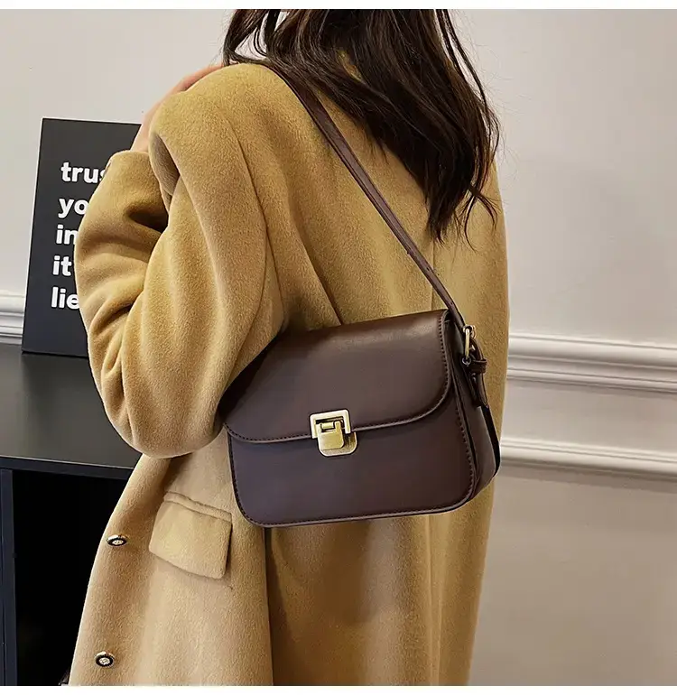 Black Leather Shoulder Bag with Gold Clasp 2023 — feature 31