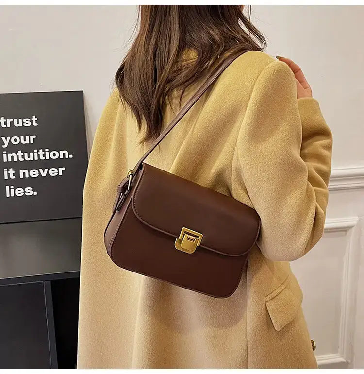 Black Leather Shoulder Bag with Gold Clasp 2023 — feature 32