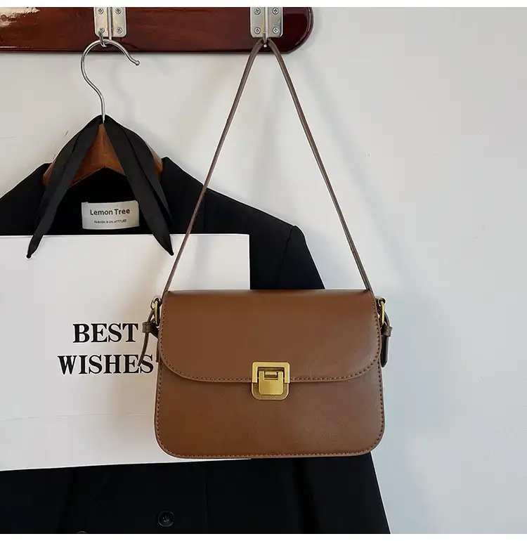 Black Leather Shoulder Bag with Gold Clasp 2023 — feature 43