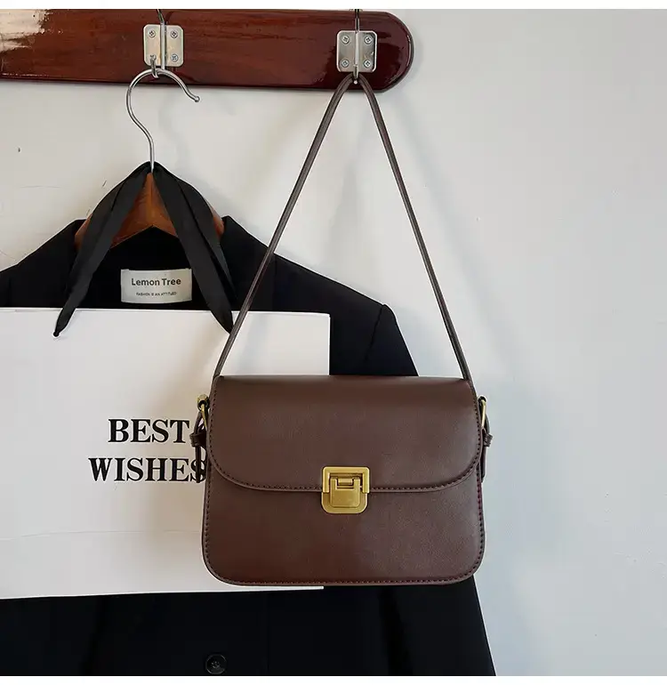 Black Leather Shoulder Bag with Gold Clasp 2023 — feature 45