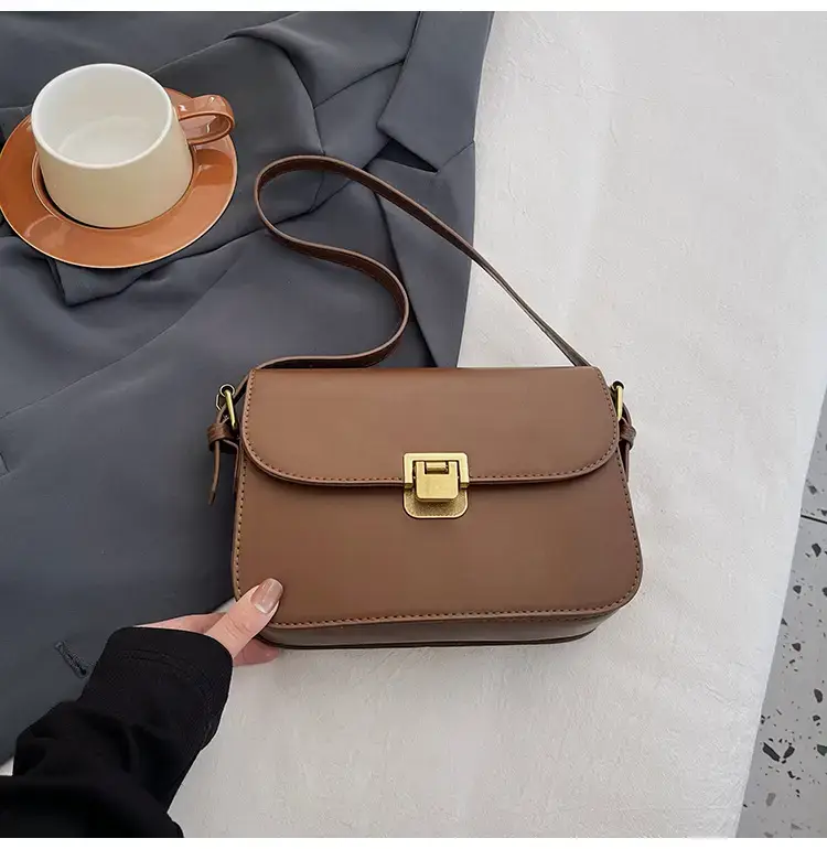 Black Leather Shoulder Bag with Gold Clasp 2023 — feature 46