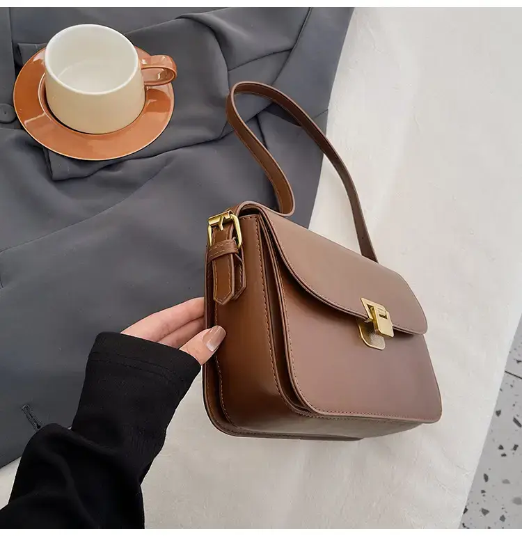 Black Leather Shoulder Bag with Gold Clasp 2023 — feature 47