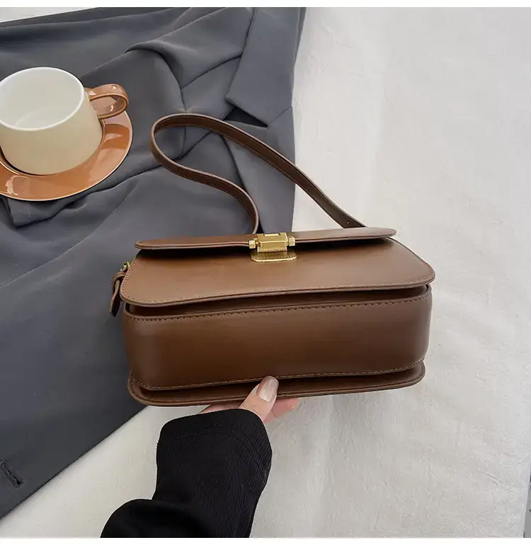 Black Leather Shoulder Bag with Gold Clasp 2023 — feature 48