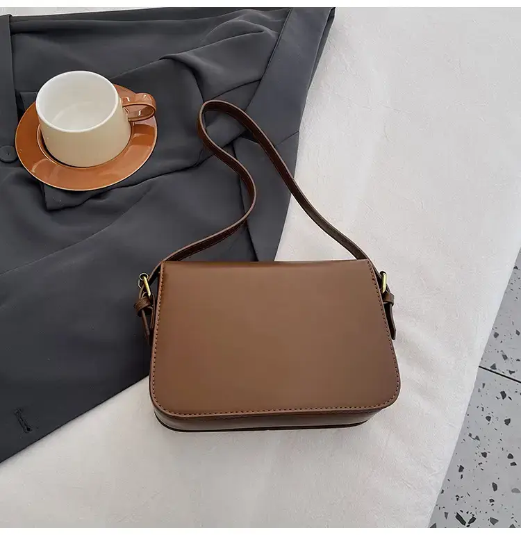 Black Leather Shoulder Bag with Gold Clasp 2023 — feature 49