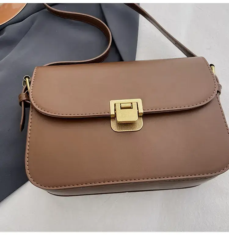 Black Leather Shoulder Bag with Gold Clasp 2023 — feature 50