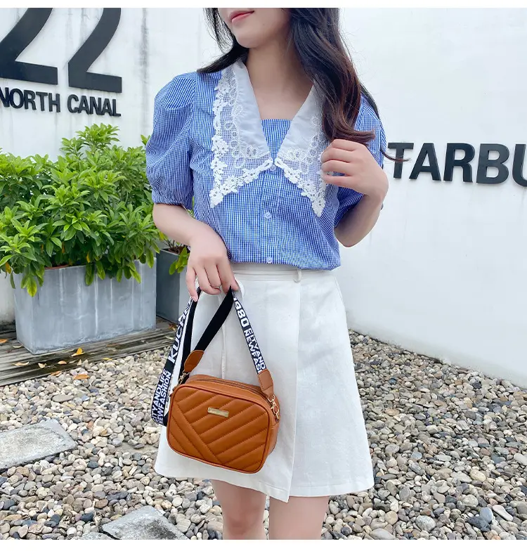 White Quilted Crossbody Bag with Embroidered Design — feature 21