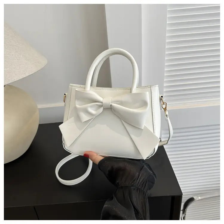 White Textured Bow Crossbody Bag 2023 — feature 10