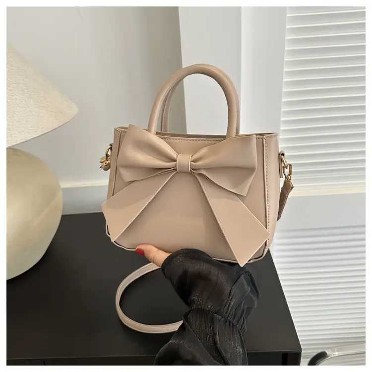 White Textured Bow Crossbody Bag 2023 — feature 16