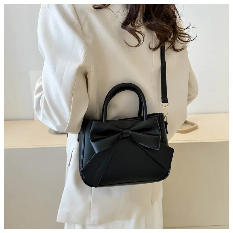 White Textured Bow Crossbody Bag 2023 — feature 21