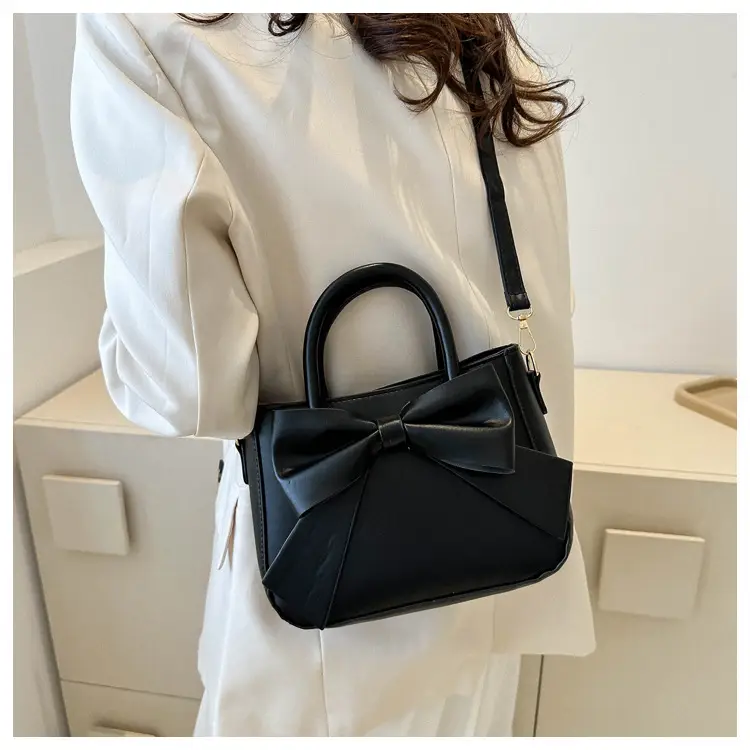 White Textured Bow Crossbody Bag 2023 — feature 22