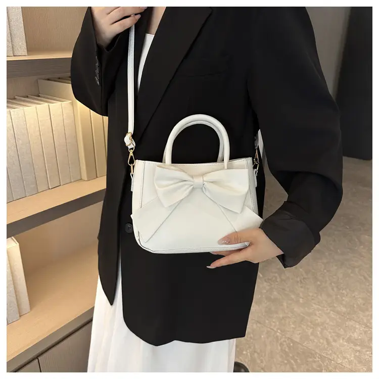 White Textured Bow Crossbody Bag 2023 — feature 23